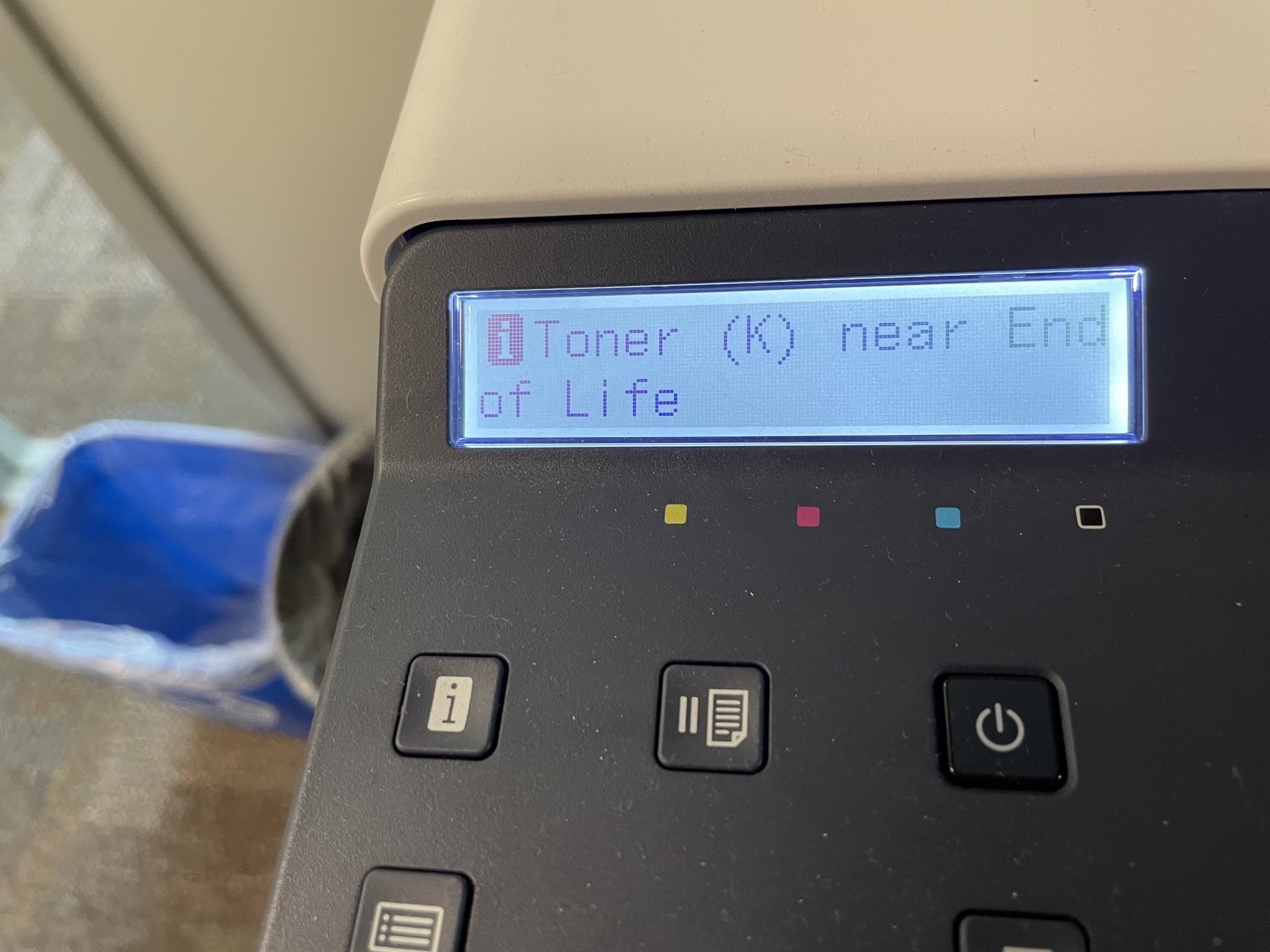 Text on printer display that reads “Toner (K) near End of Life.”