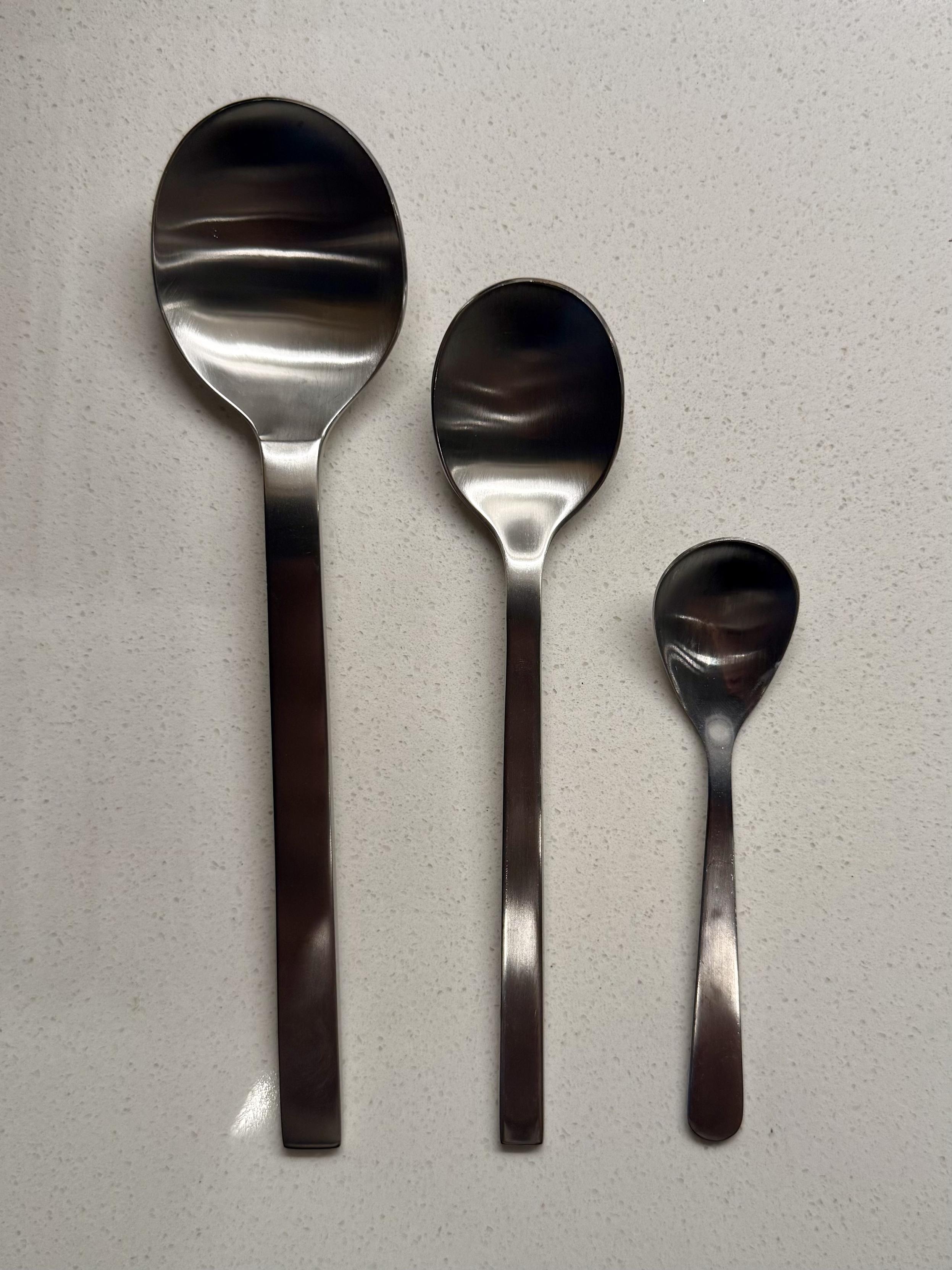 3 spoons in descending size order 
L–R
Big stupid spoon that pretty much never gets used but it came in the set
Normal spoon that Kev uses 
My favorite tiny spoon