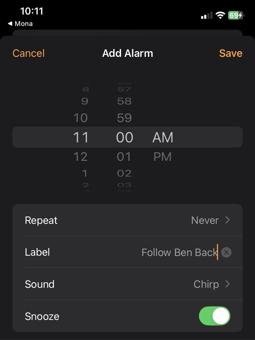 A mobile phone screen displaying a settings menu for alarms. The screen is black with white text. The cursor is at the Label section that says “Follow Ben Back”