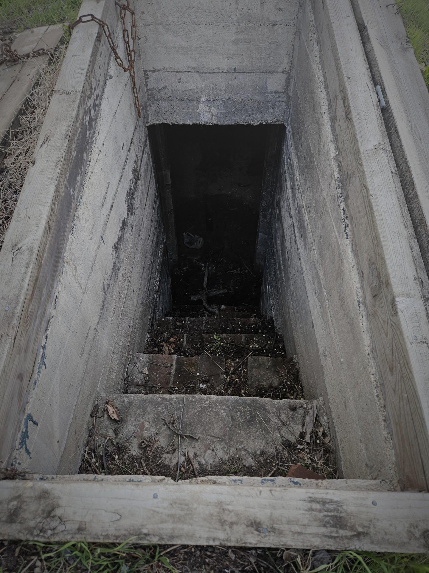 A closer image of the opening, you can see stairs going into the dark