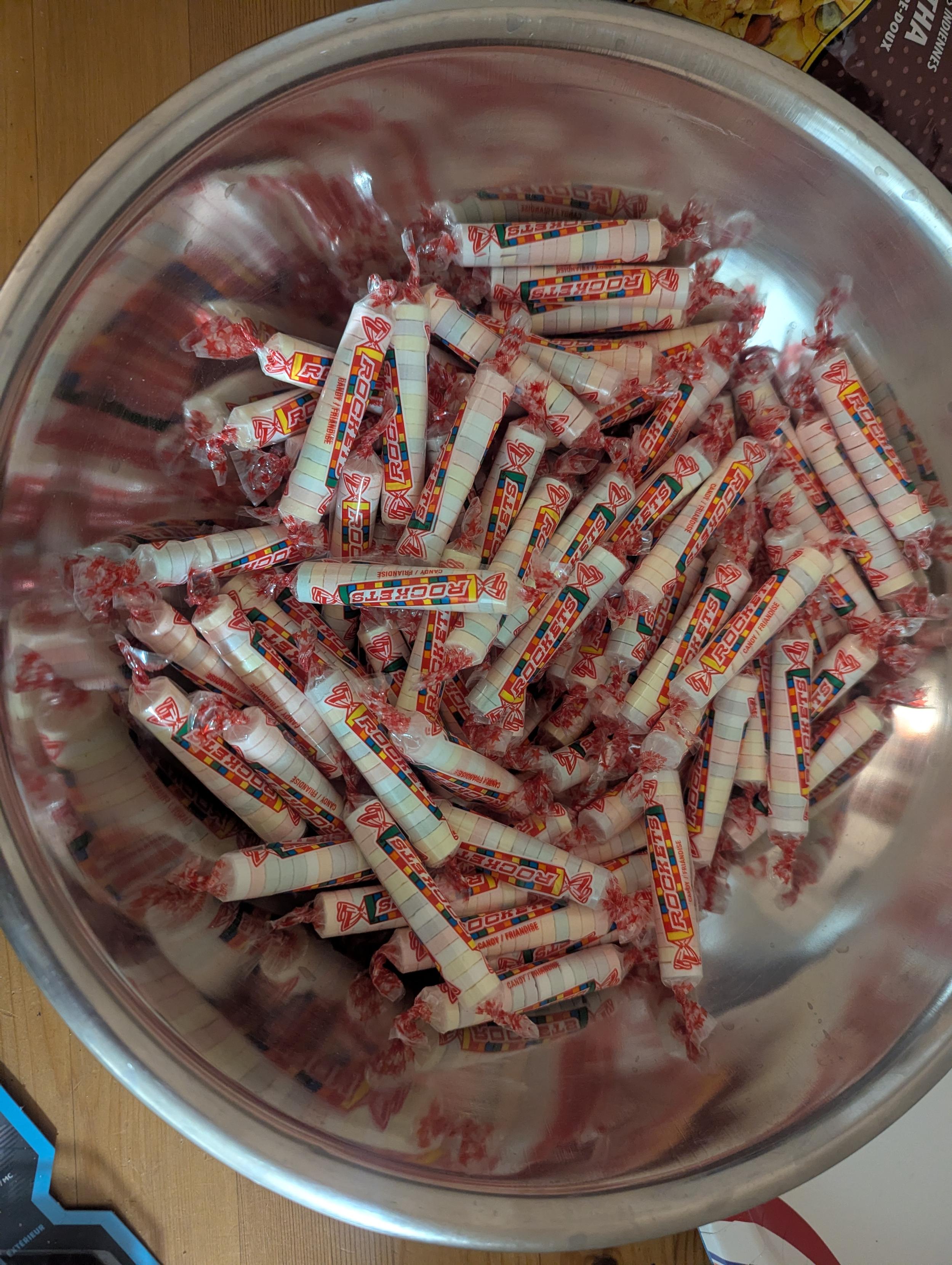 A metal bowl full of Rockets candy (what Americans call "Smarties"). They're kinda chalky.