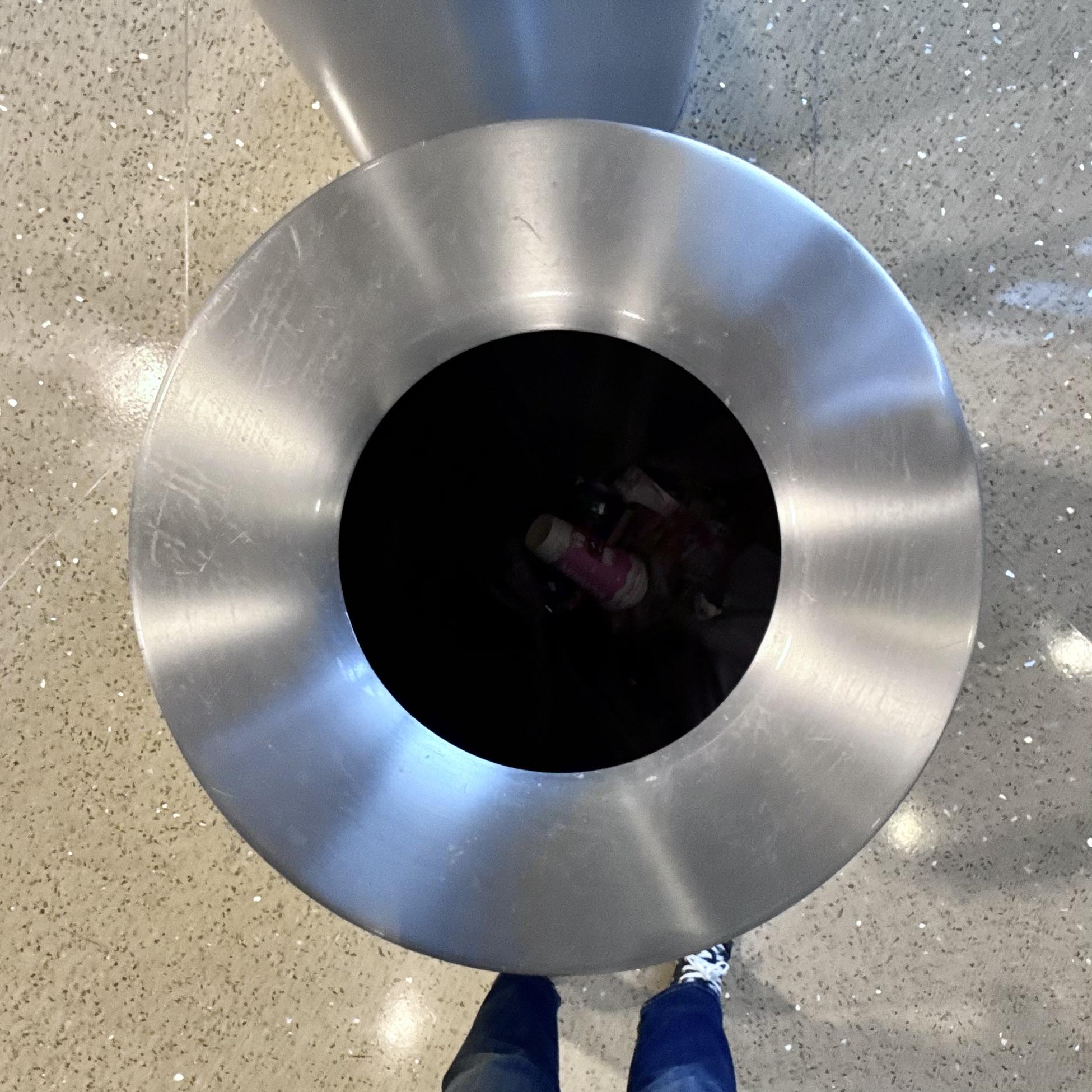 Downward shot into a metal garbage can