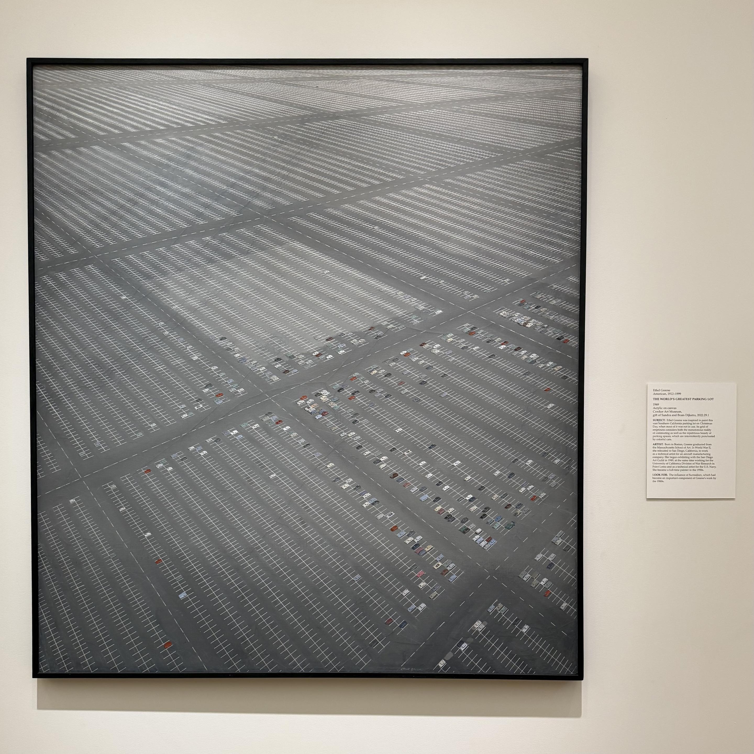 The World's Greatest Parking Lot by Ethel Greene, which is a large almost monochromatic looking painting of a large grey parking lot with a small assortment of cars parked throughout.
