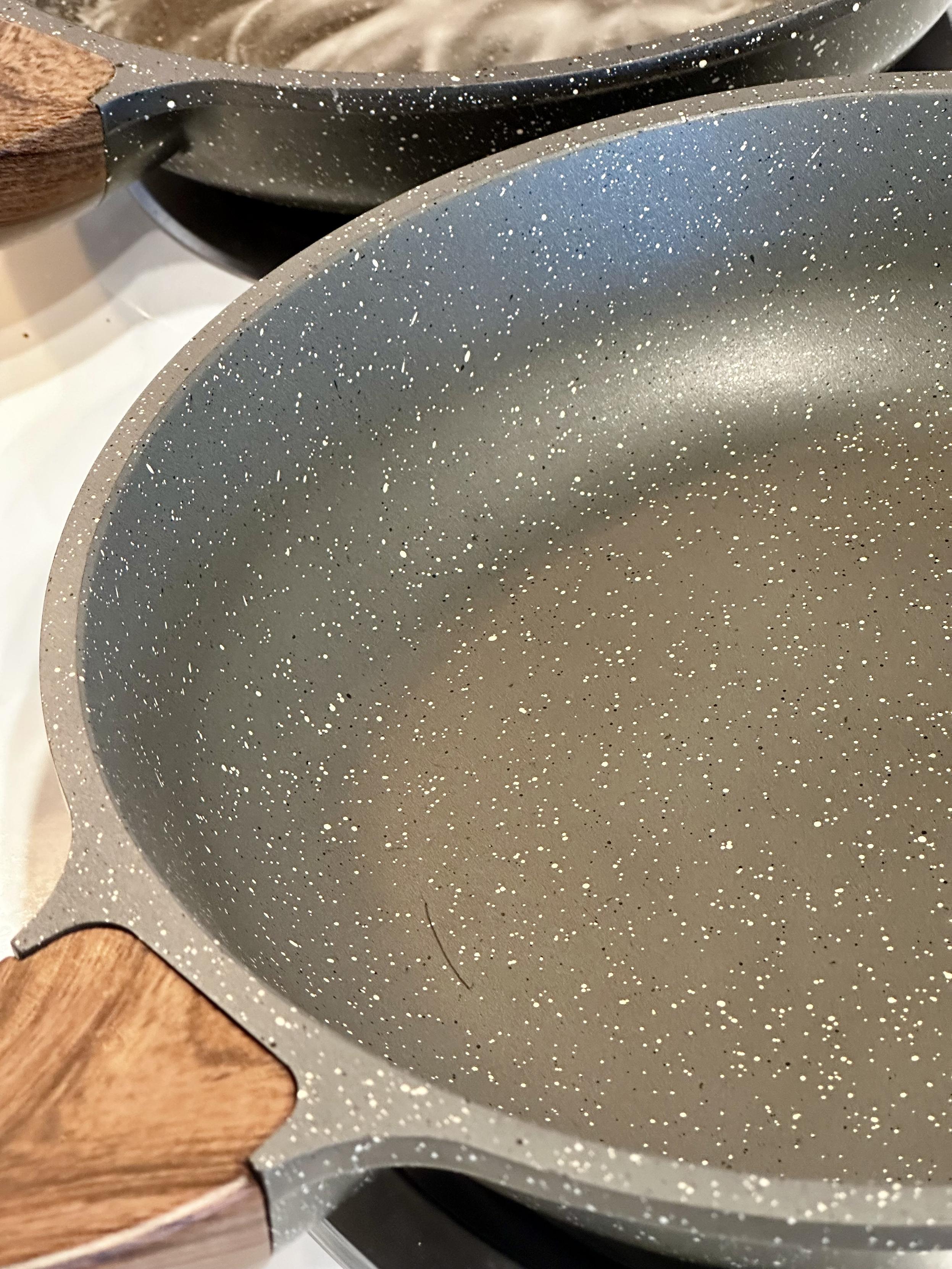 Look what happened after treating the other of the 2 skillets. You can tell this is another pan if you enlarge to see the scratch on the pan surface towards the handle that goes to the left bottom right corner of the photo. It was similarly stained brown and now restored evenly to a lighter gray coating. Very dramatic improvement.